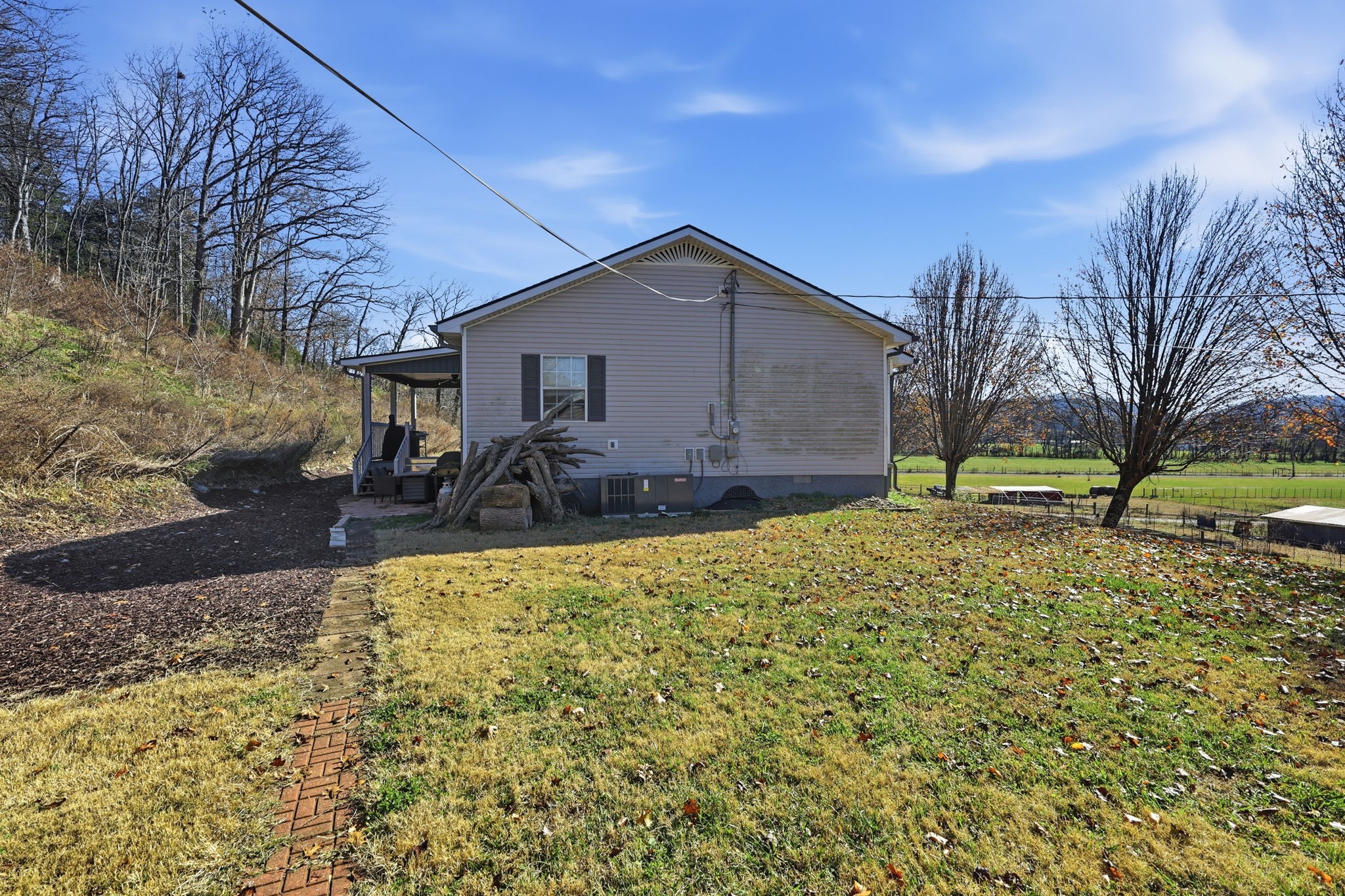 600 East Main Street Dowelltown, TN 37059 - Photo 48 of 54 a backyard of a house with table and chairs