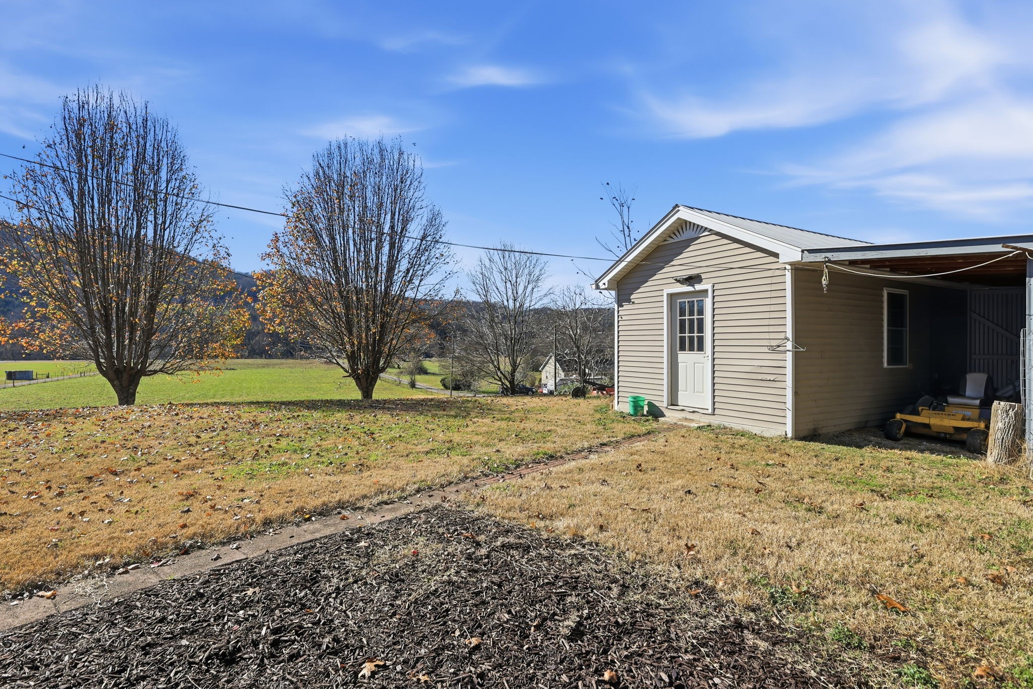 600 East Main Street Dowelltown, TN 37059 - Photo 49 of 54 a view of a house with a yard covered in snow