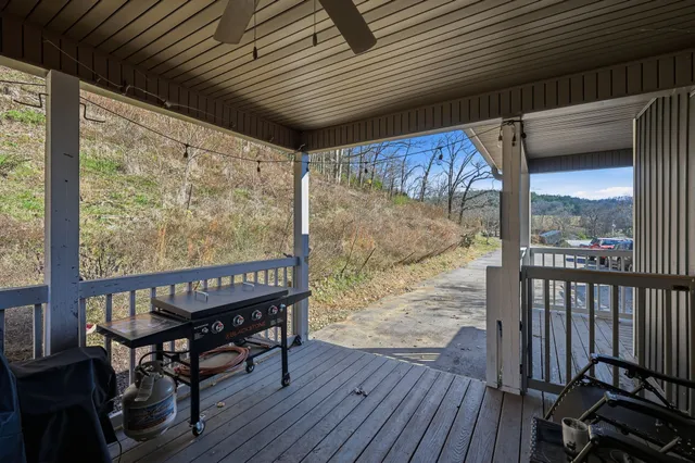 a view of a balcony with furniture