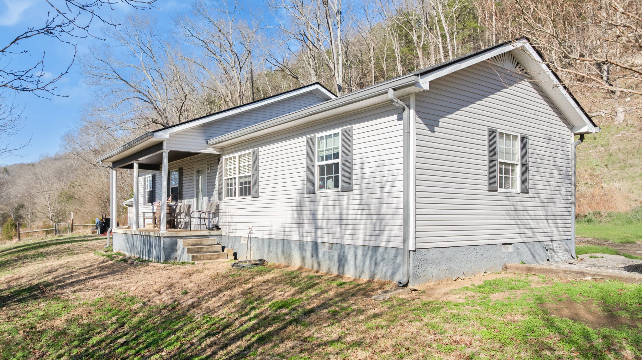 600 East Main Street Dowelltown, TN 37059 - Photo 9 of 54 a backyard of a house with table and chairs
