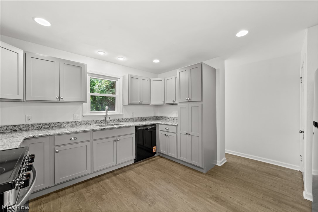 6444 Wilson Mills Road Cleveland, OH 44143 - Photo 2 of 29 Beautifully Updated Kitchen with New Cabinets, Counters, Stainless Steel Appliances, Flooring and Lighting