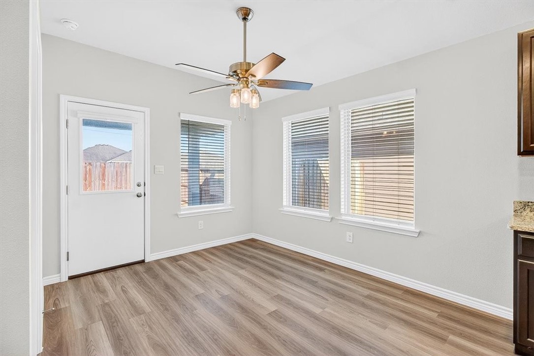 1626 Comfy Way Corpus Christi, TX 78418 - Photo 13 of 40 a view of an empty room with a window