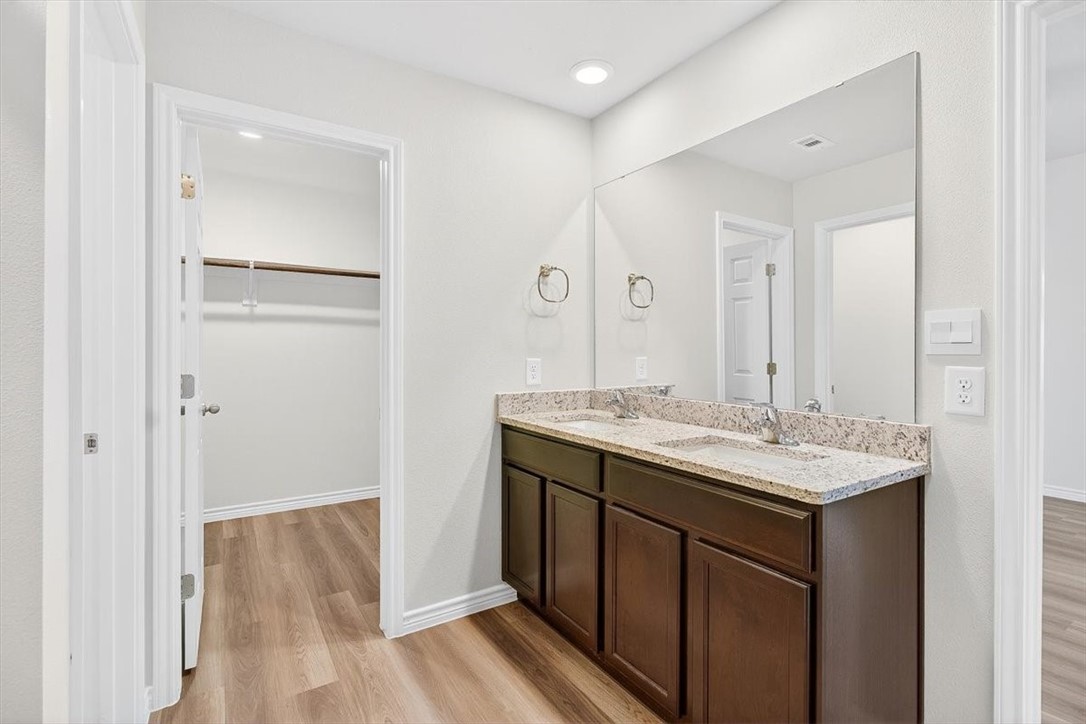 1626 Comfy Way Corpus Christi, TX 78418 - Photo 20 of 40 a bathroom with a sink and a mirror