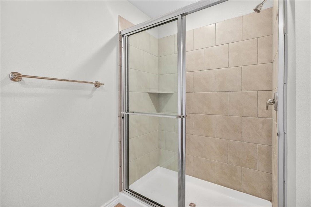 1626 Comfy Way Corpus Christi, TX 78418 - Photo 21 of 40 a bathroom with a glass shower door