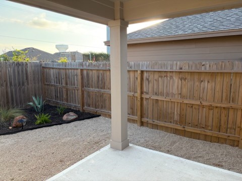 1626 Comfy Way Corpus Christi, TX 78418 - Photo 36 of 40 a view of a backyard with a small cabin and a chair