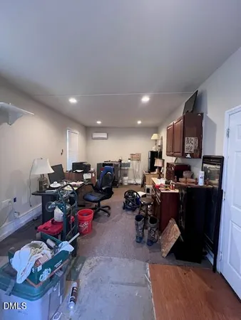 a living room with lots of furniture and a dining table with wooden floor