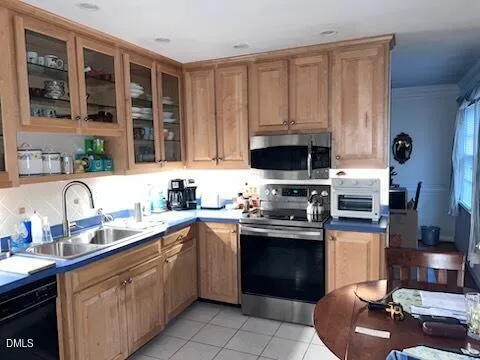 a kitchen with stainless steel appliances granite countertop a stove sink and cabinets