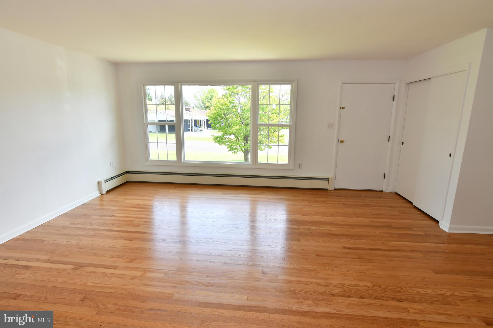 437 Beechcroft Road Winchester, VA 22601 - Photo 13 of 52 a view of empty room with wooden floor and fan