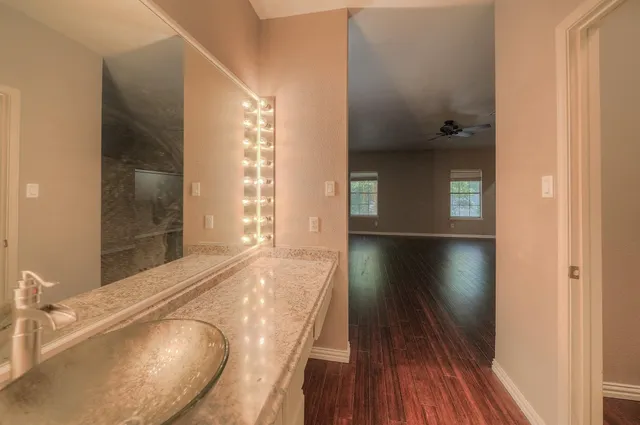 a view of a living room with a wooden floor