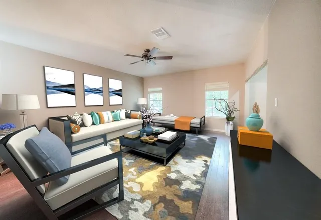 a living room with furniture and a large window