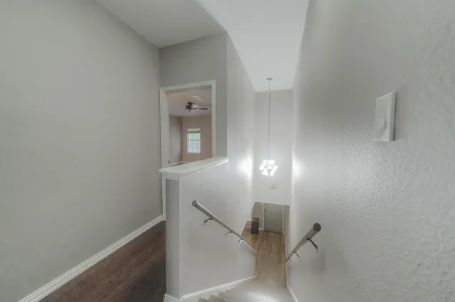 a view of a hallway with workspace