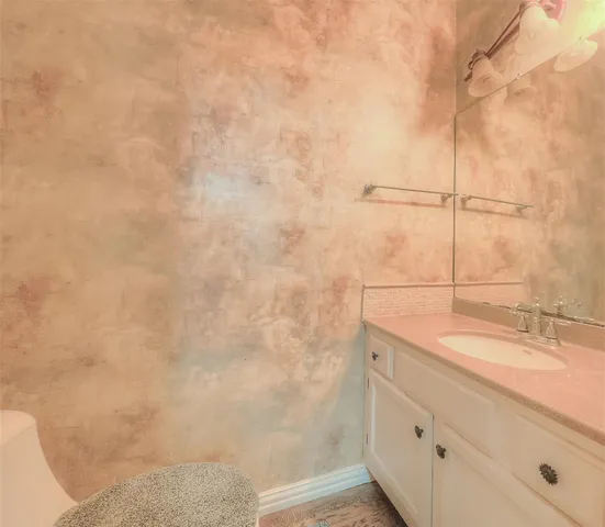 a bathroom with a sink and vanity