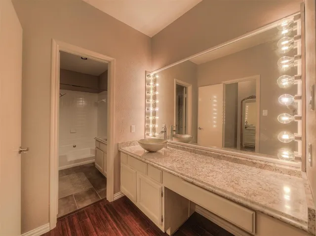 a bathroom with a sink and a mirror