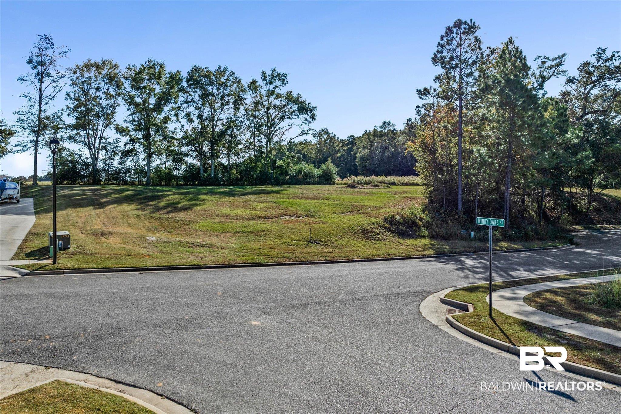 0 Acorn Way Grand Bay, AL 36541 - Photo 3 of 17 View of asphalt street with curbs and sidewalks