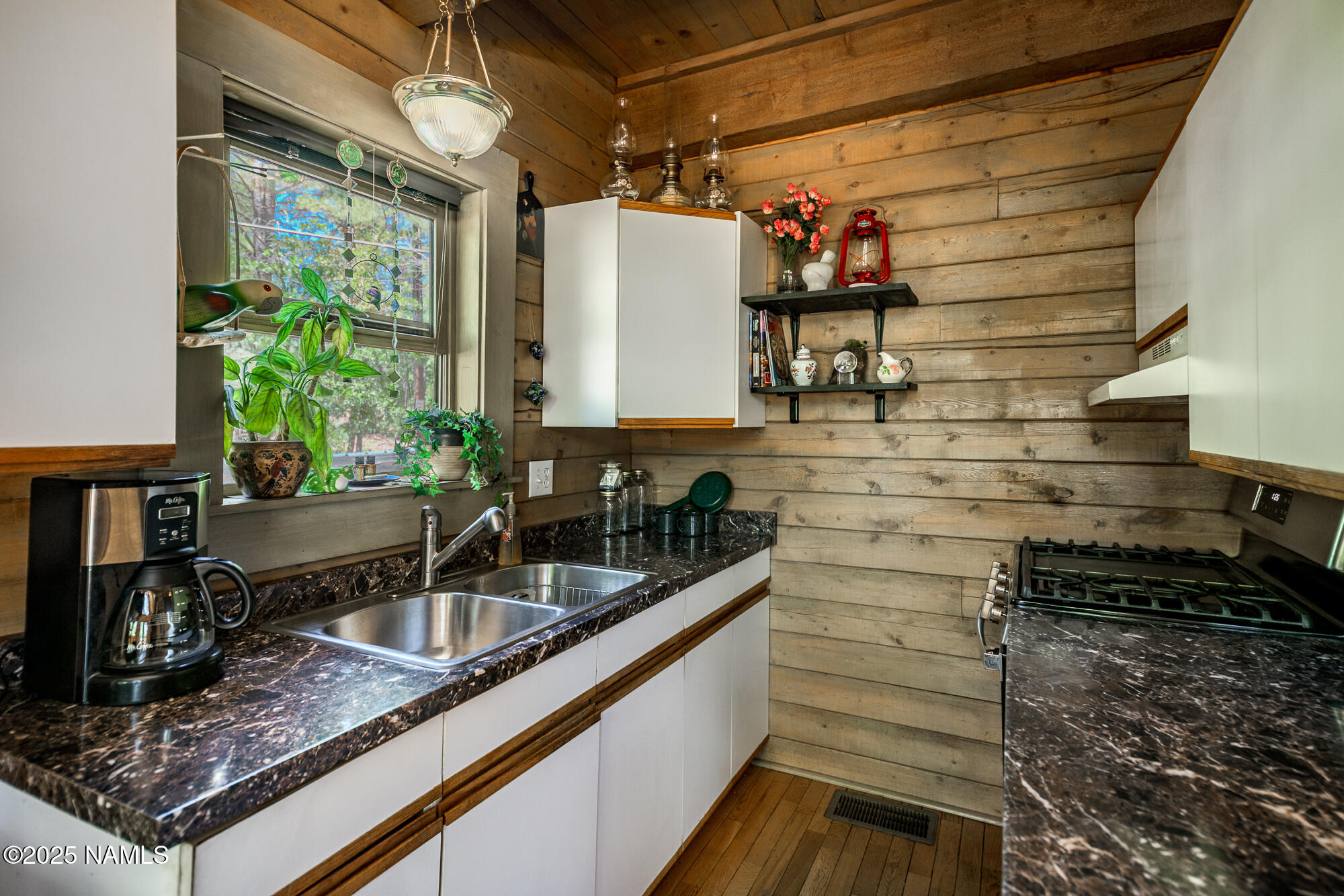 4680 Mormon Lake Road Mormon Lake, AZ 86038 - Photo 13 of 34 a kitchen with sink and refrigerator
