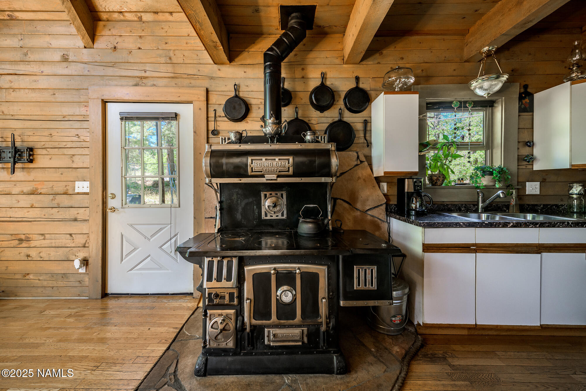 4680 Mormon Lake Road Mormon Lake, AZ 86038 - Photo 16 of 34 a kitchen with stainless steel appliances granite countertop a stove and a sink