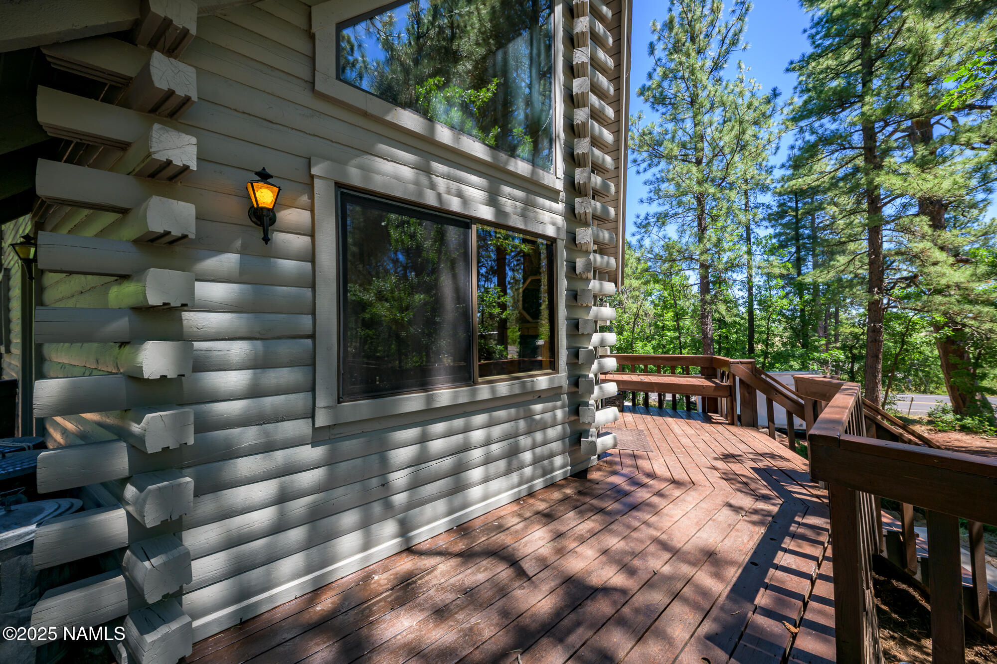 4680 Mormon Lake Road Mormon Lake, AZ 86038 - Photo 23 of 34 a view of a porch with wooden chairs and floor