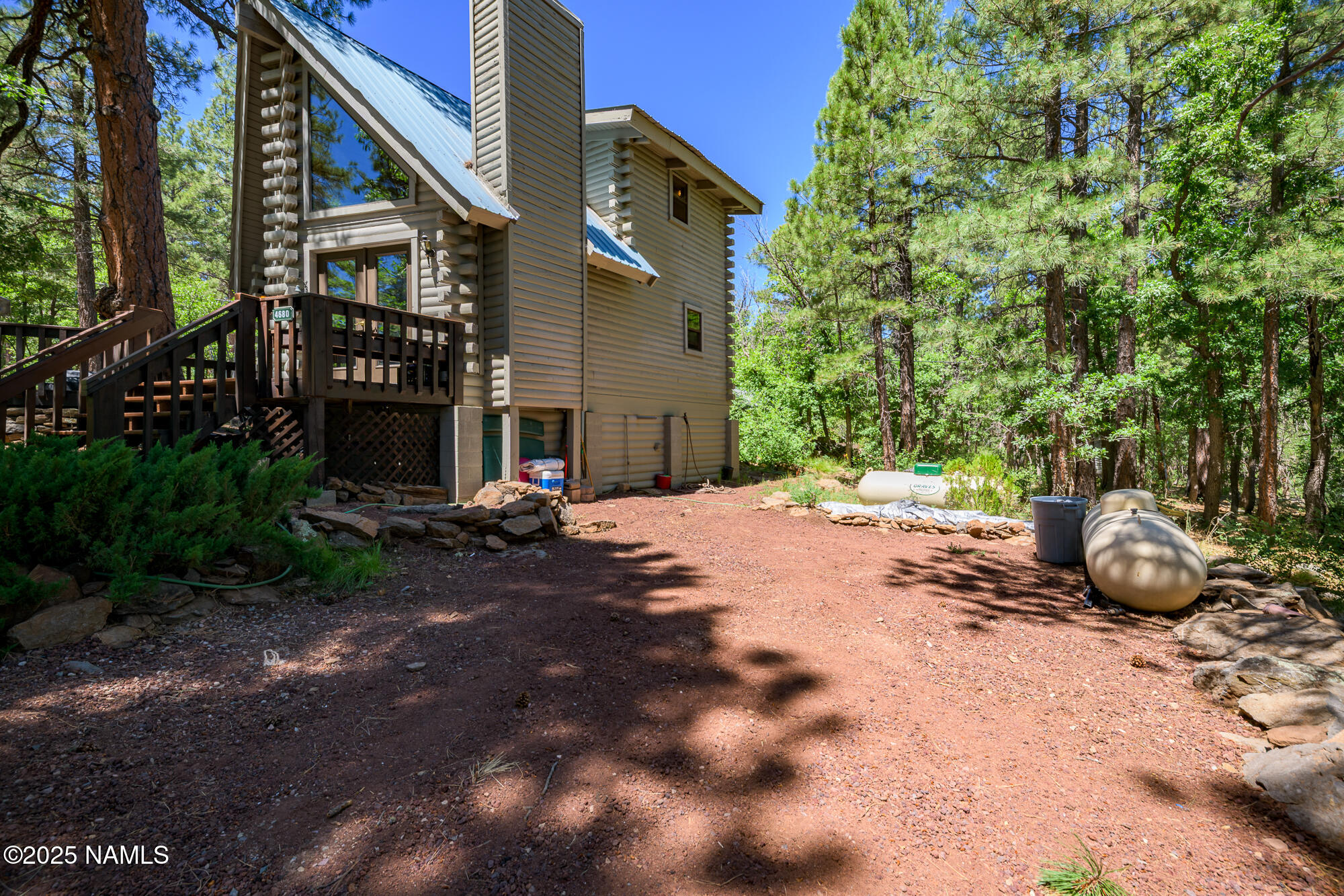 4680 Mormon Lake Road Mormon Lake, AZ 86038 - Photo 27 of 34 a view of a house with backyard and sitting area