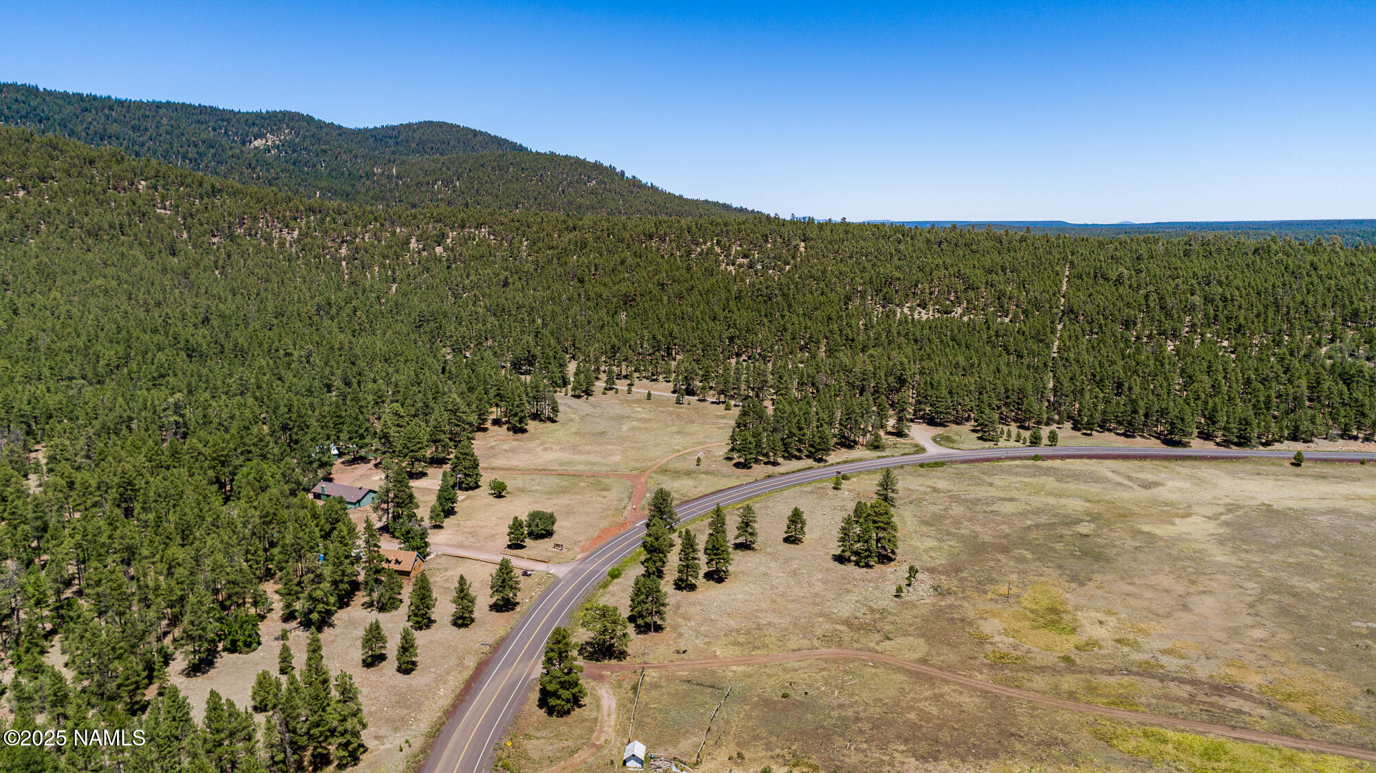 4680 Mormon Lake Road Mormon Lake, AZ 86038 - Photo 29 of 34 a view of a city with mountains in the background