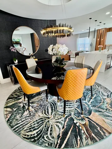 a living room with furniture and a mirror