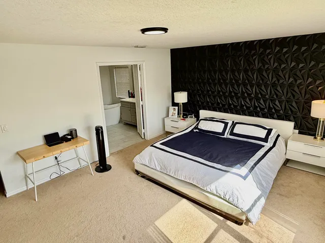 a living room with furniture rug and wooden floor