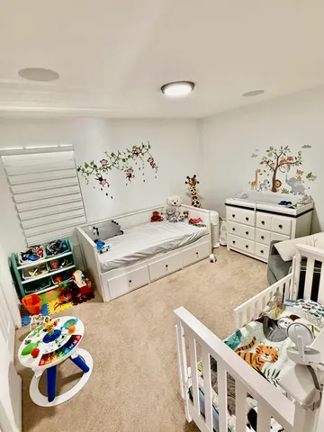 a bedroom with furniture and a window