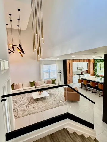 a kitchen with stainless steel appliances granite countertop a sink and a stove