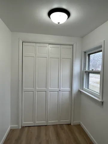 an empty room with a empty space and windows