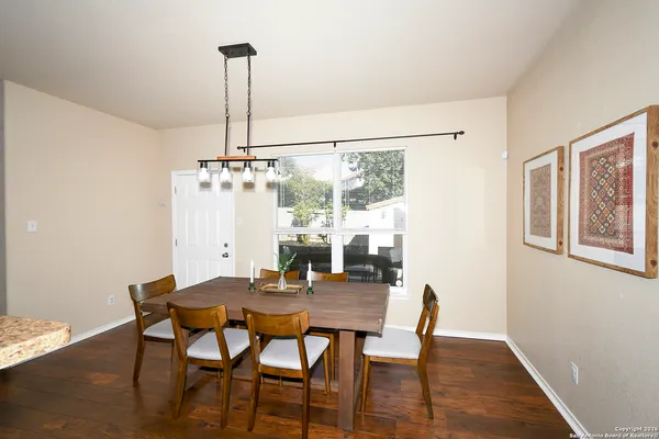 a view of a dining room with furniture window and wooden floor