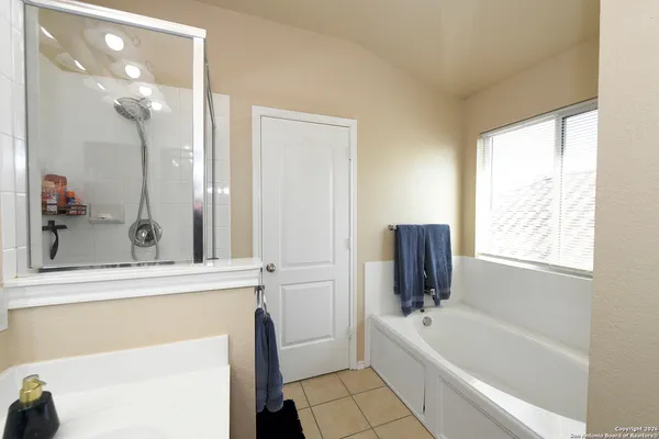 a bathroom with a bathtub and a sink