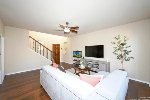 a living room with furniture and a flat screen tv