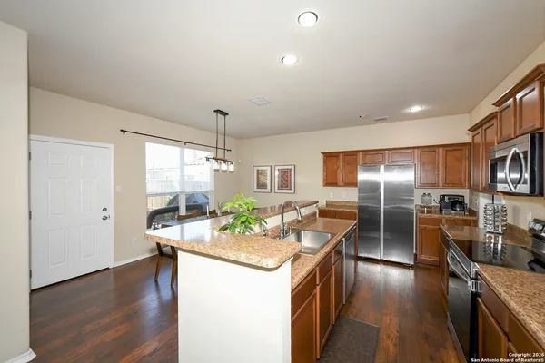 a kitchen with counter top space cabinets and stainless steel appliances