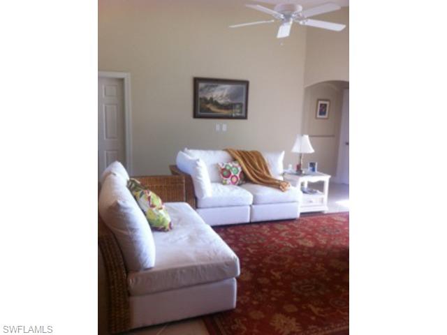 8248 Quaker Place Naples, FL 34104 - Photo 3 of 14 a living room with furniture and wall paintings