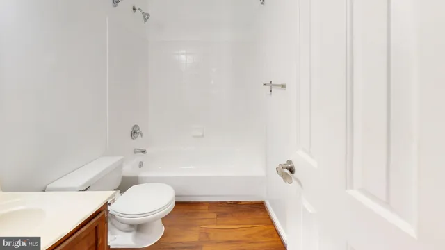 a bathroom with a bathtub and toilet