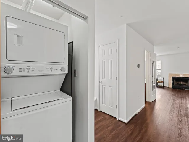 a view of washer and dryer with wooden floor