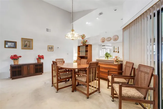 a dining room with furniture and window