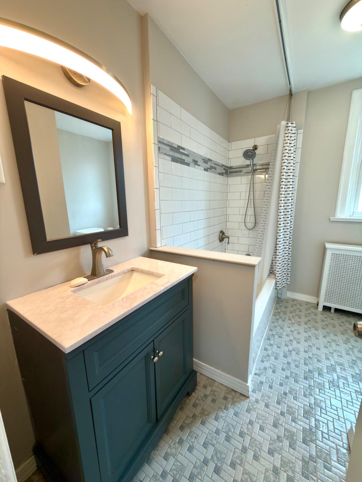 1723 Chelsea Road Elkins Park, PA 19027 - Photo 22 of 38 a bathroom with a sink mirror and a bathtub