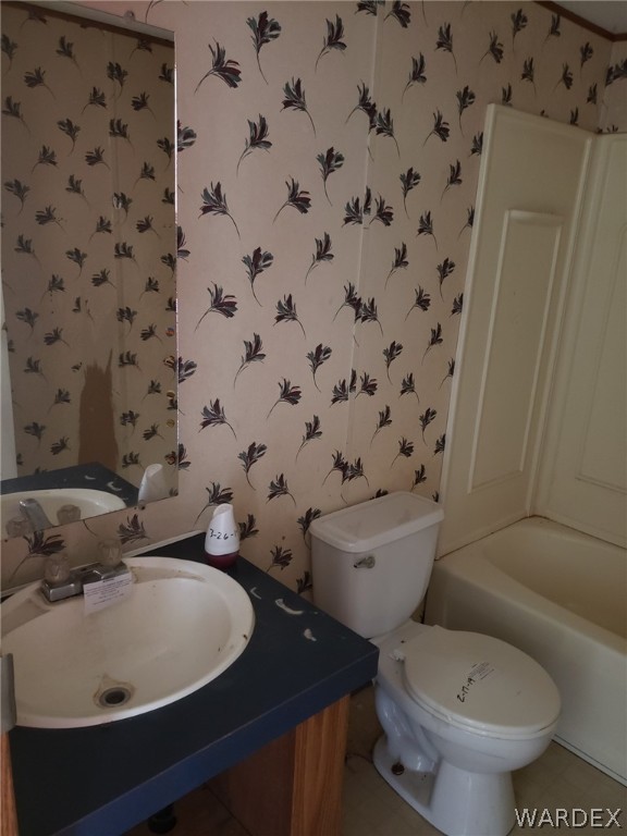 14185 Powerline Road Kingman, AZ 86401 - Photo 17 of 22 a bathroom with a sink and a toilet