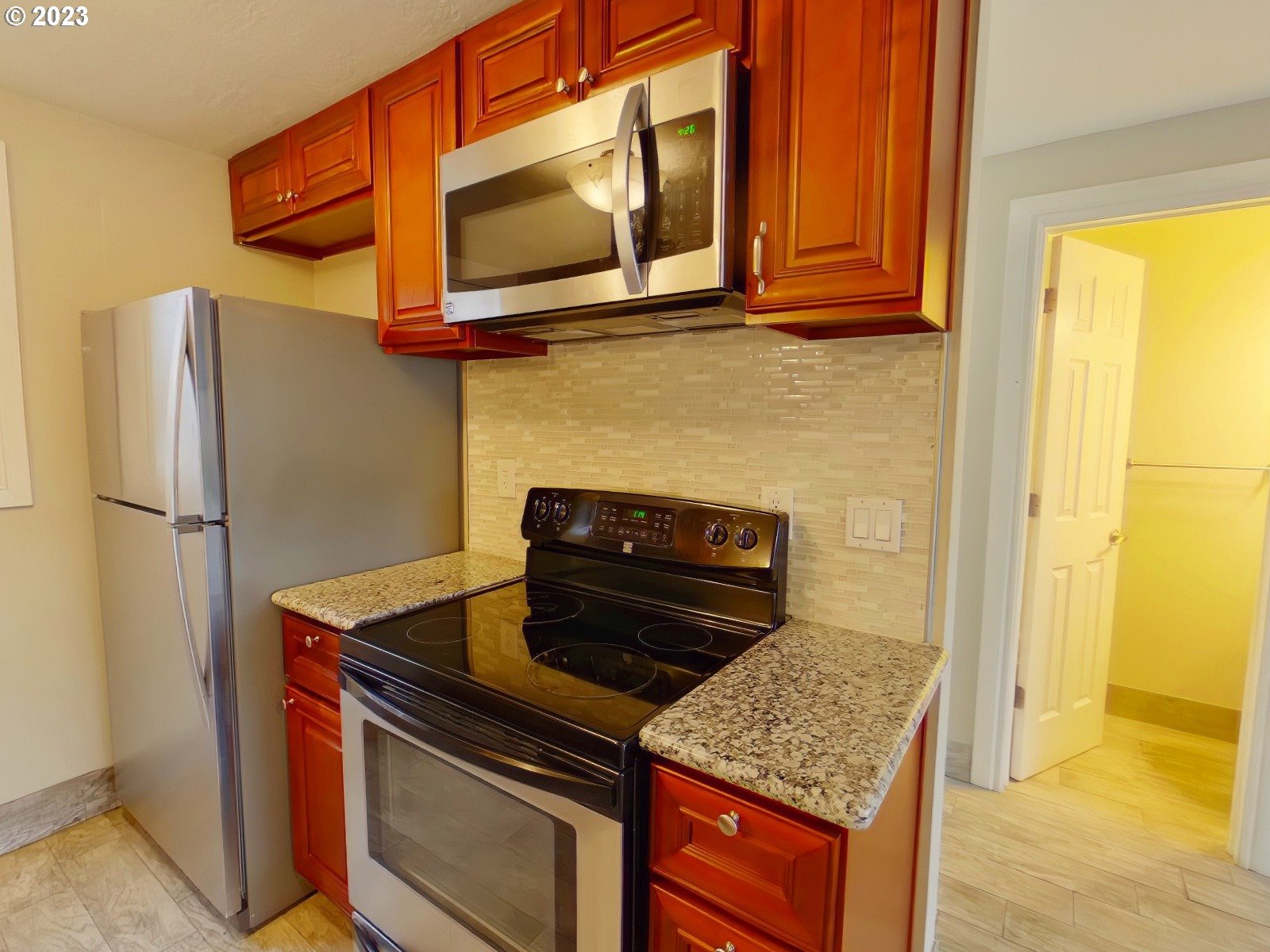 925 Anderson Lane Springfield, OR 97477 - Photo 16 of 19 a kitchen with stainless steel appliances granite countertop cabinets and a stove top oven