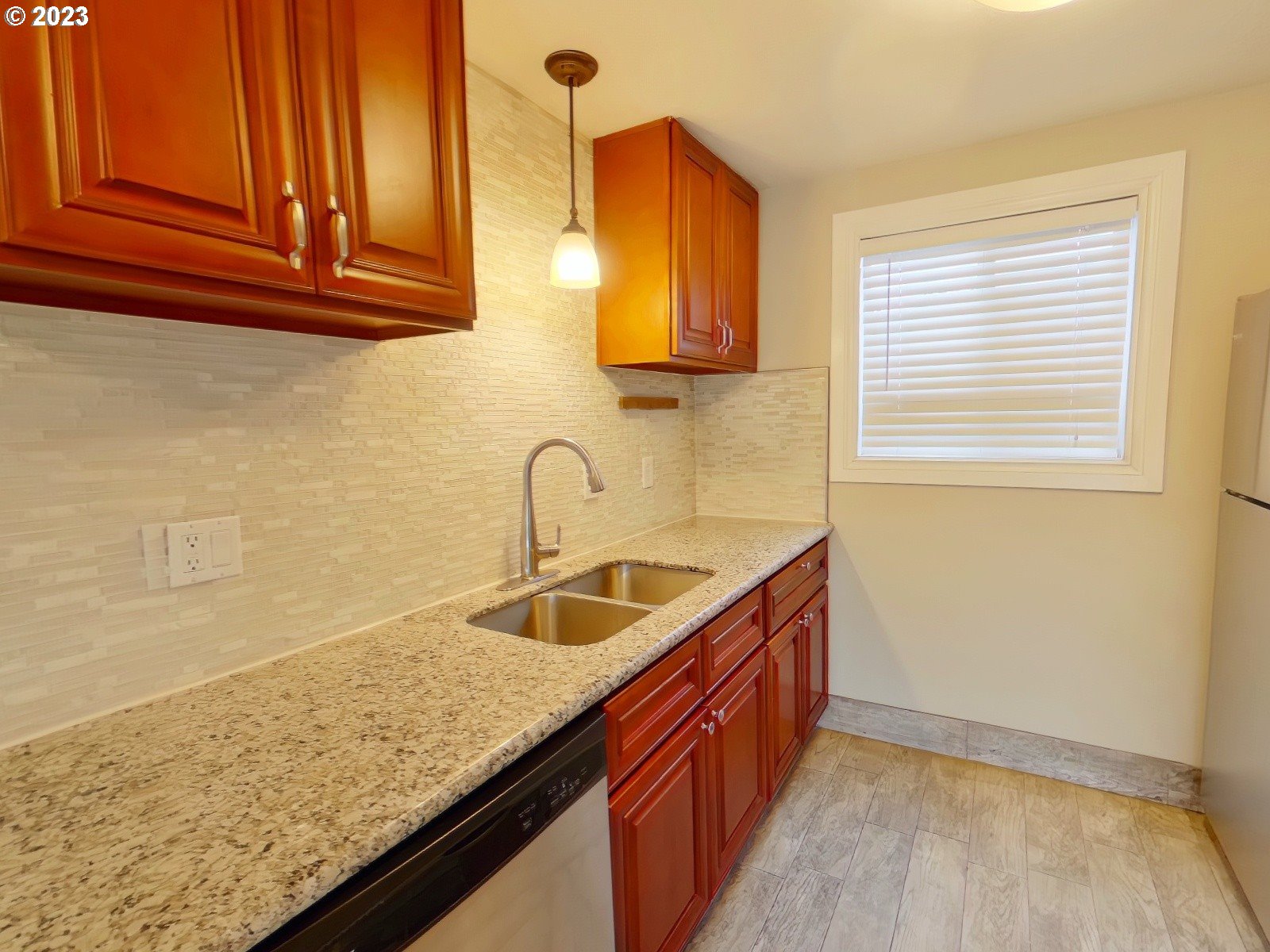 925 Anderson Lane Springfield, OR 97477 - Photo 17 of 19 a kitchen with stainless steel appliances granite countertop a sink and a wooden cabinets