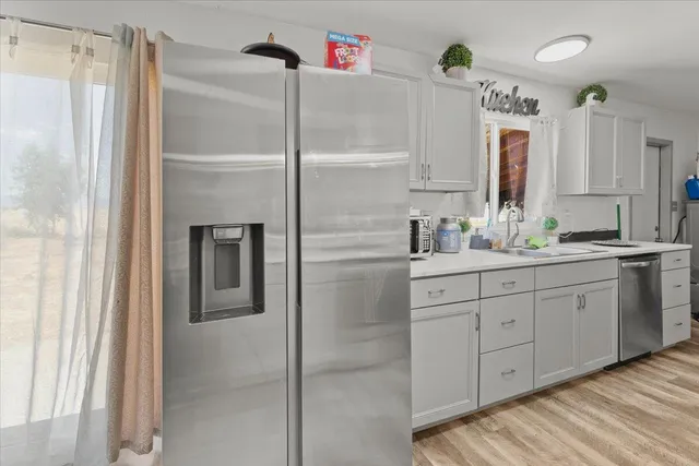 a kitchen with a sink and a stove top oven