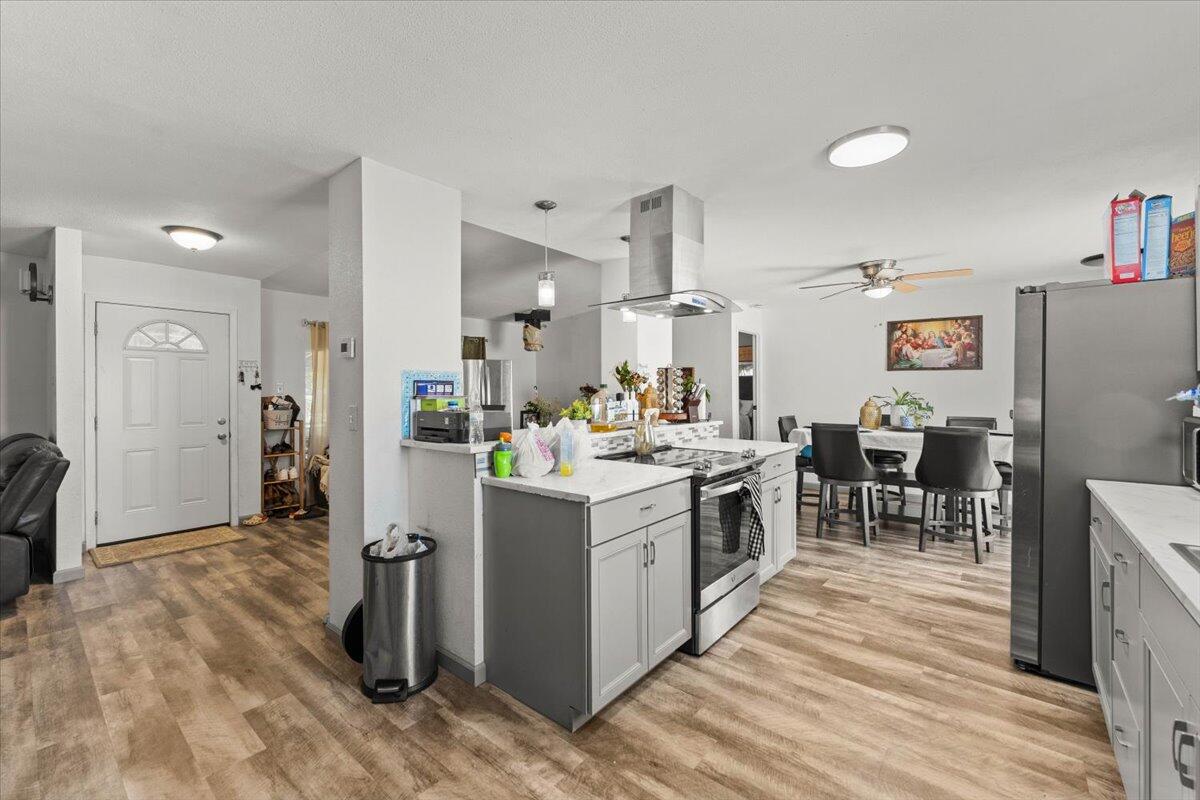 10755 Cody Drive Red Bluff, CA 96080 - Photo 15 of 77 a kitchen with a sink and a stove top oven