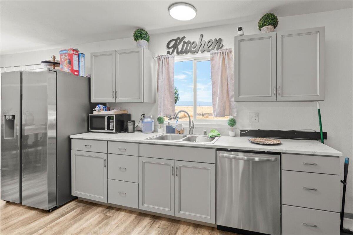 10755 Cody Drive Red Bluff, CA 96080 - Photo 16 of 77 a kitchen with cabinets appliances and a window