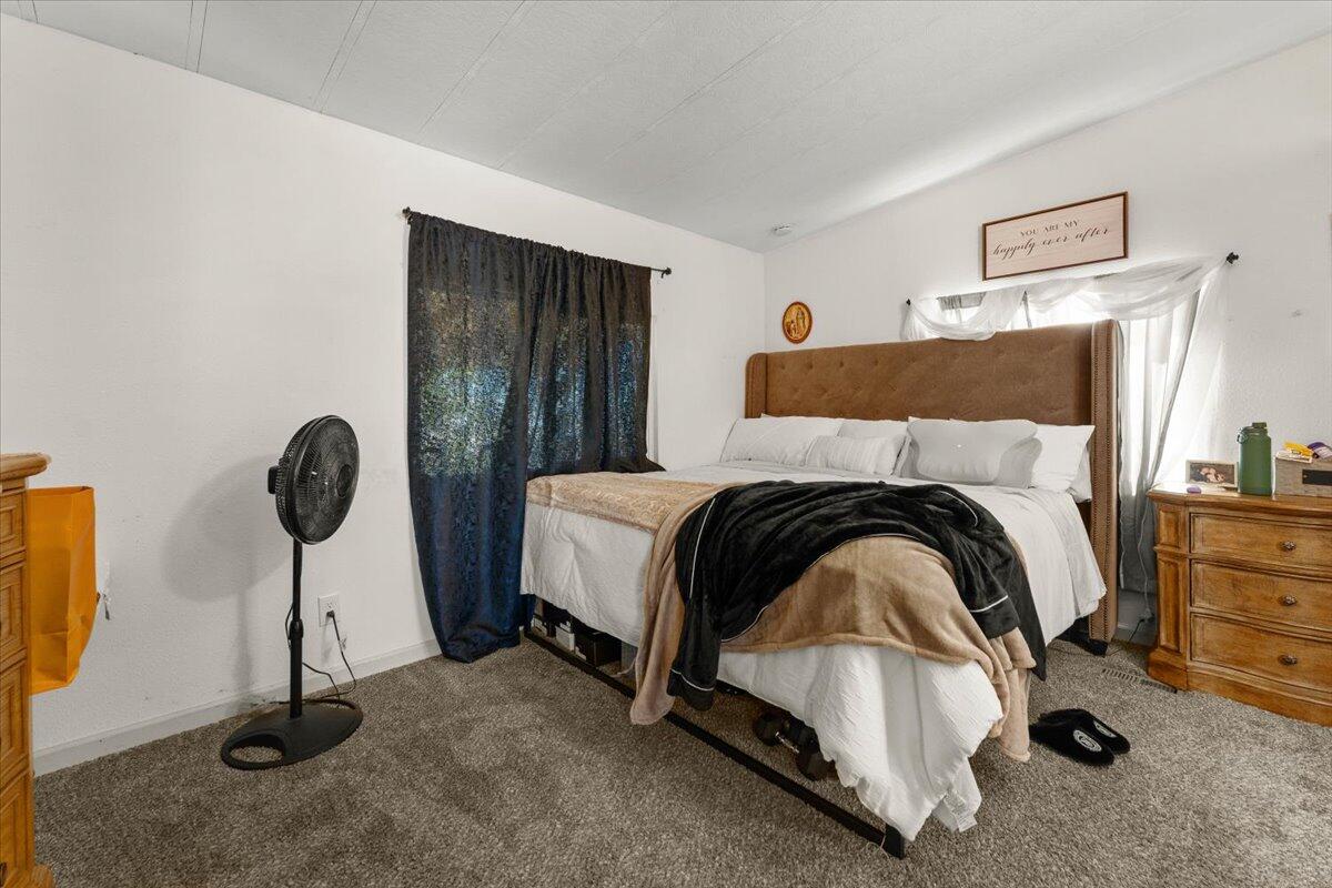 10755 Cody Drive Red Bluff, CA 96080 - Photo 19 of 77 a bedroom with a bed and a cabinets