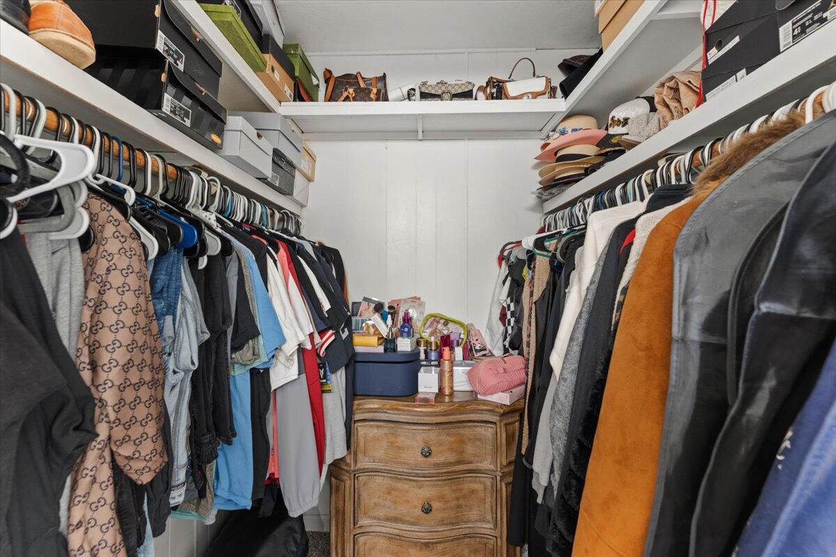 10755 Cody Drive Red Bluff, CA 96080 - Photo 23 of 77 a view of walk in closet with clothes and shoes
