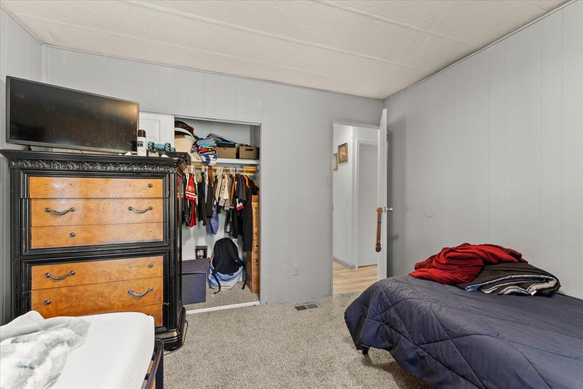 10755 Cody Drive Red Bluff, CA 96080 - Photo 28 of 77 a bedroom with a bed and a flat tv screen