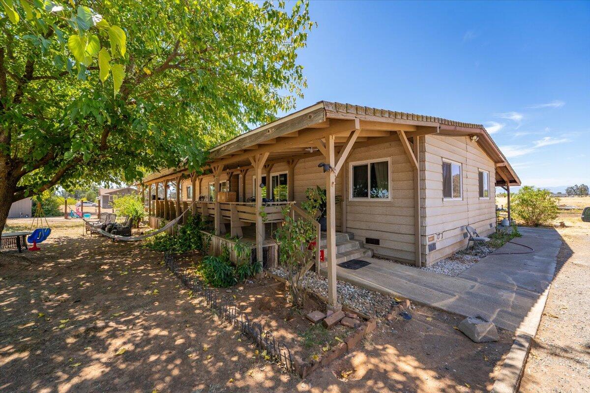 10755 Cody Drive Red Bluff, CA 96080 - Photo 48 of 77 a view of a small house with a yard