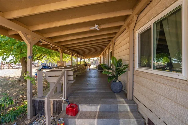 a view of house with outdoor space and sitting area