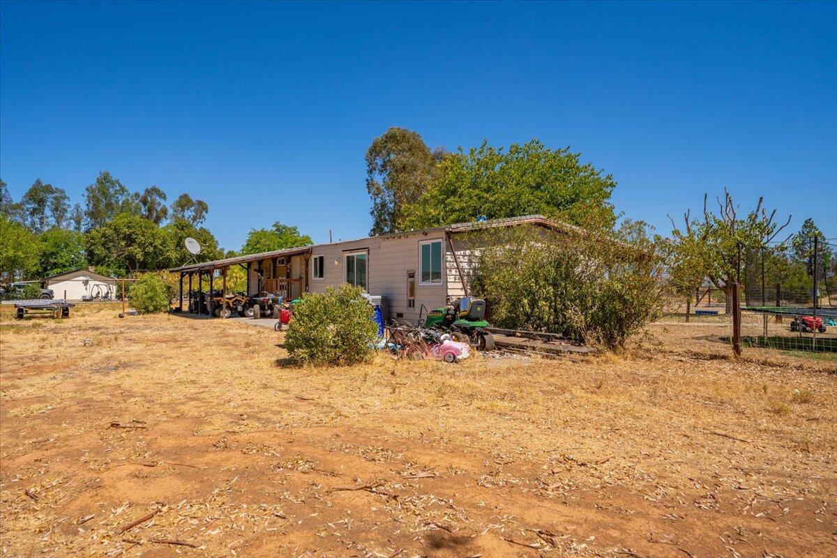 10755 Cody Drive Red Bluff, CA 96080 - Photo 75 of 77 a view of house with outdoor space and sitting area