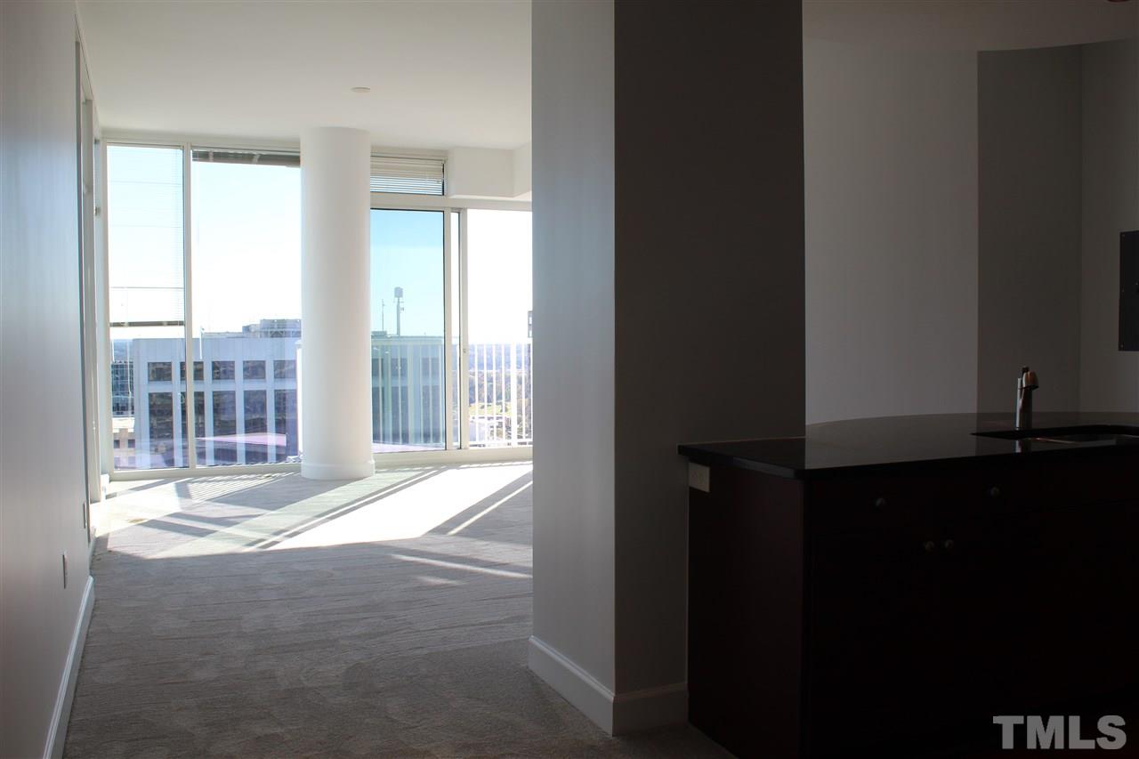 301 Fayetteville Street, Unit 2408 Raleigh, NC 27601 - Photo 6 of 19 Walk through the door and be met immediately with floor to ceiling views of Raleigh's skyline.